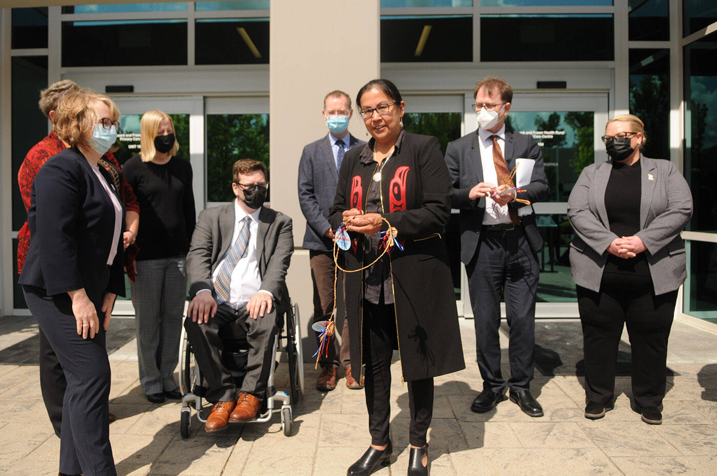 Aitchelitz Chief Angie Bailey (centre) smiles during the ribbon cutting ceremony of the new Primary Care Centre in Chilliwack on Friday, May 13, 2022. (Jenna Hauck/ Chilliwack Progress)