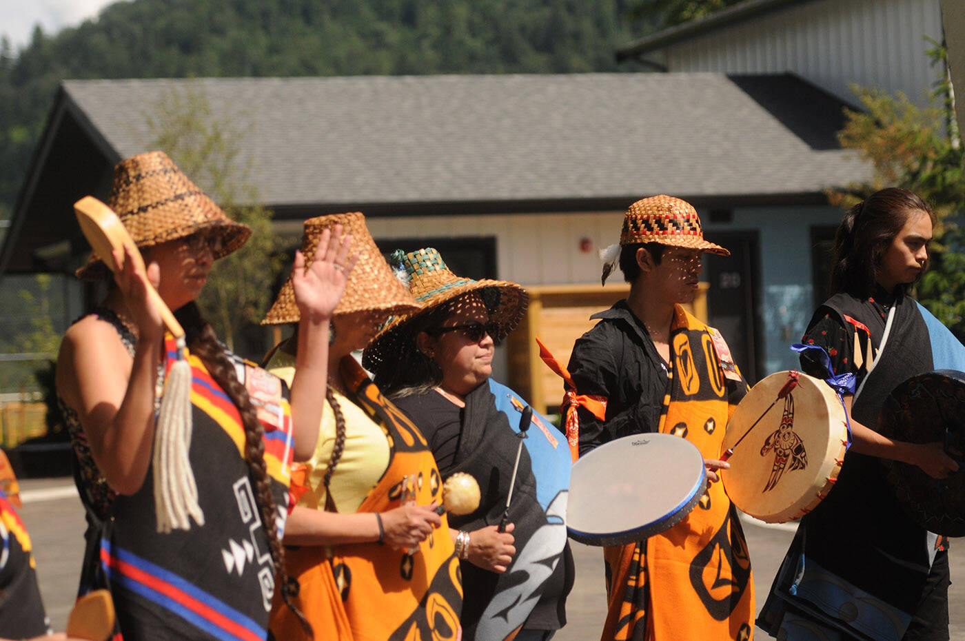 Drummers sing outside the Tzeachten affordable housing project during the grand opening on Thursday, June 23, 2022. (Jenna Hauck/ Chilliwack Progress)