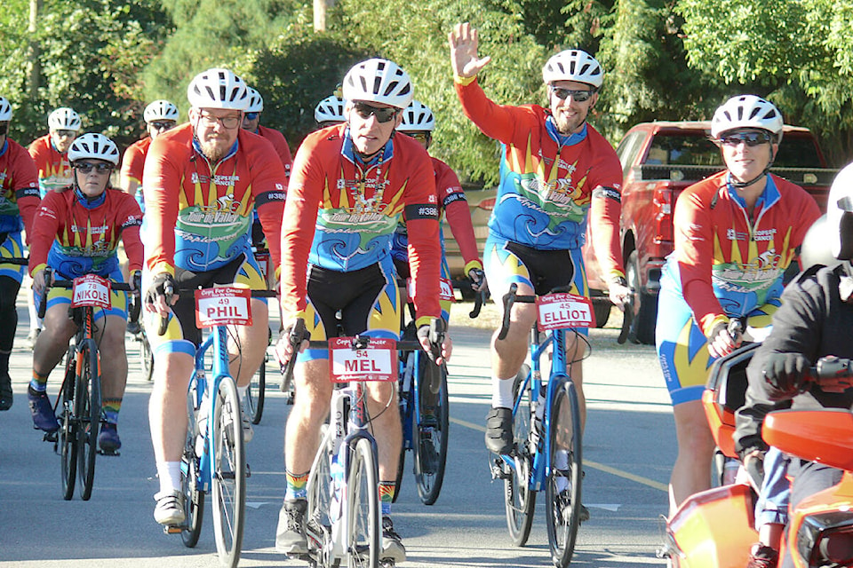 34 riders on the Cops for Cancer Tour de Valley team began a nine-day, 800 kilometre journey through the Fraser Valley in Langley on Wednesday, Sept. 21, where students at the Langley Fine Arts School cheered them on their way. (Dan Ferguson/Langley Advance Times)