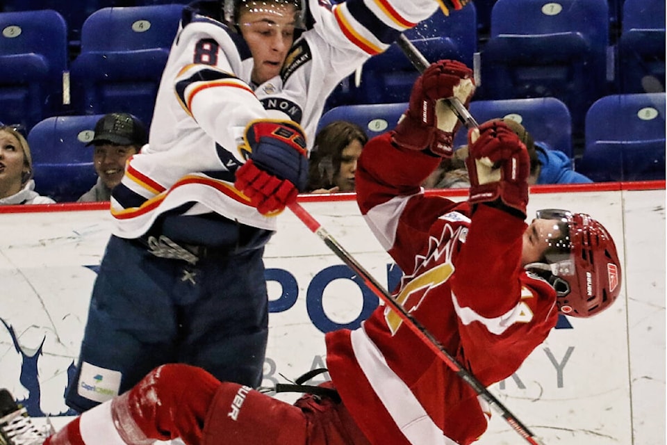 Vernon defenceman David Brandes (left) gives Chilliwack forward Bryan Jones a rough ride during the Vipers’ 2-1 BCHL win over the Chiefs Saturday, Nov. 5, at Kal Tire Place. (Lisa Mazurek - Vernon Vipers Photography)
