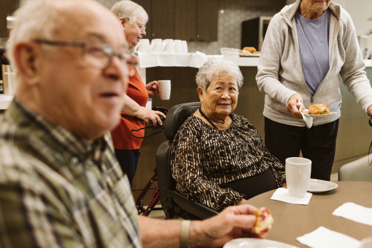 The Hawthorn is a place for people to come together as a community. Pictured are Hawthorn residents enjoying food and fellowship at the Chehalis Café & Lounge.