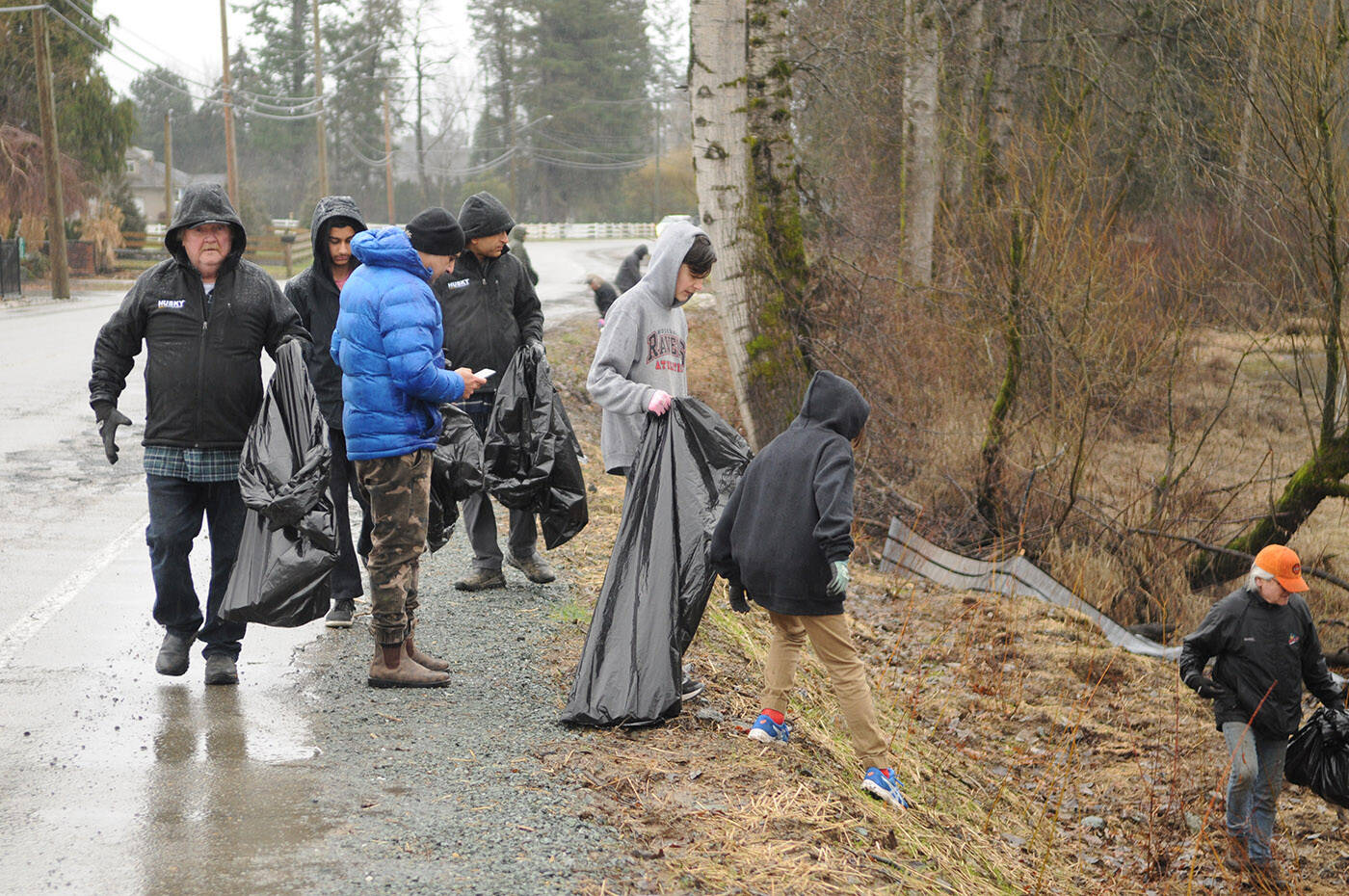 A team of about 15 people helped clean up a stretch of Hope River Road in Chilliwack on Saturday, Jan. 21, 2023. (Jenna Hauck/ Chilliwack Progress)
