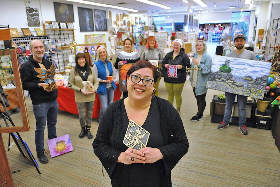 Siobhan D’Souza, executive director with the Chilliwack Community Arts Council, stands inside Dragonfly Arts and Crafts with a number of local artists on Thursday, Feb. 2, 2023. Due to renovations at Cottonwood Centre, the store must close down and the final day is Saturday, Feb. 25. (Jenna Hauck/ Chilliwack Progress)