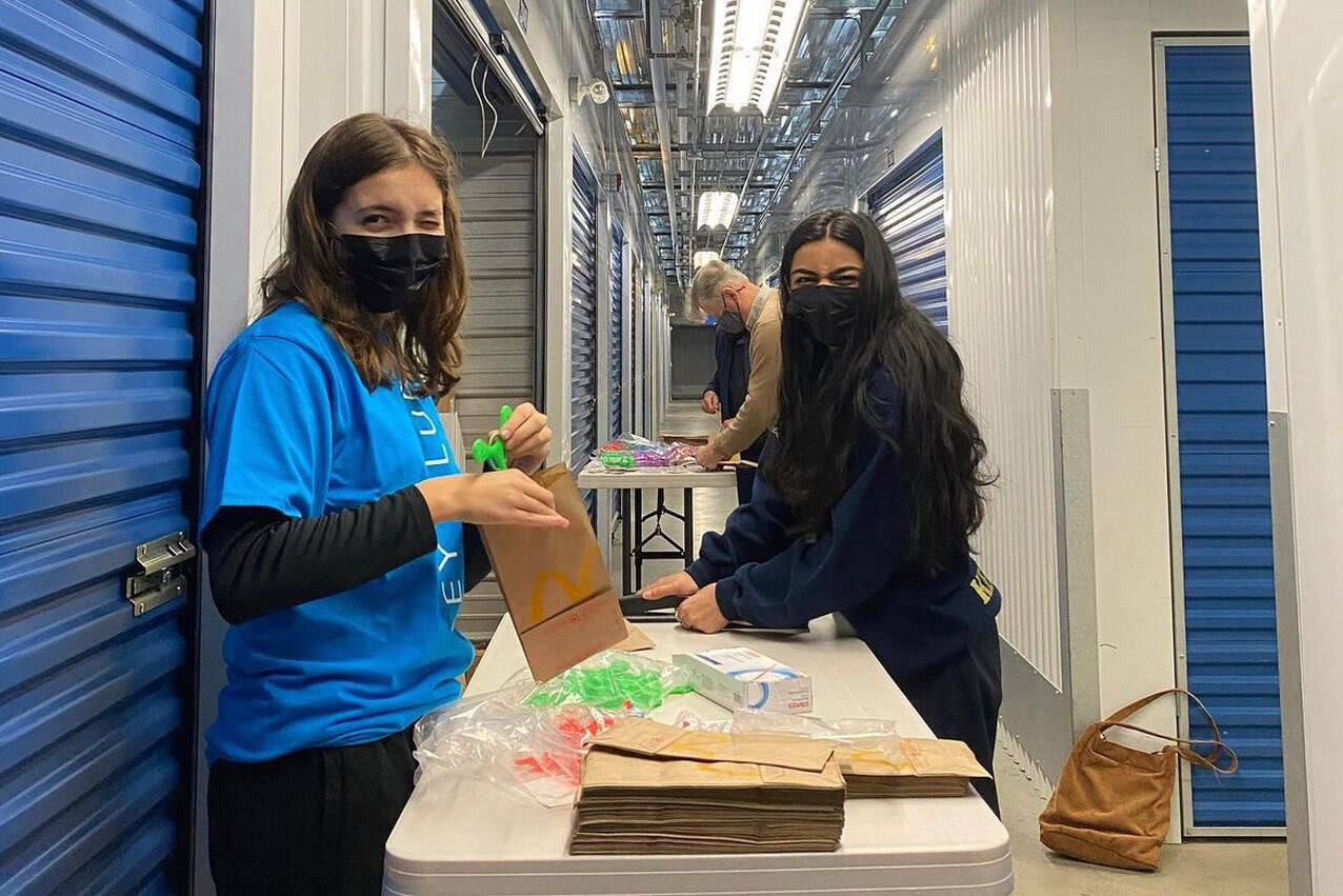 Lily Renaud of G.W. Graham Middle Secondary School (left) is one of 90 teens from across Canada selected as a Loran Scholars Foundation finalist, and she has a chance to win an award valued at more than $100,000. She is seen here volunteering with the Kiwanis Key Club. (Submitted by Lily Renaud)