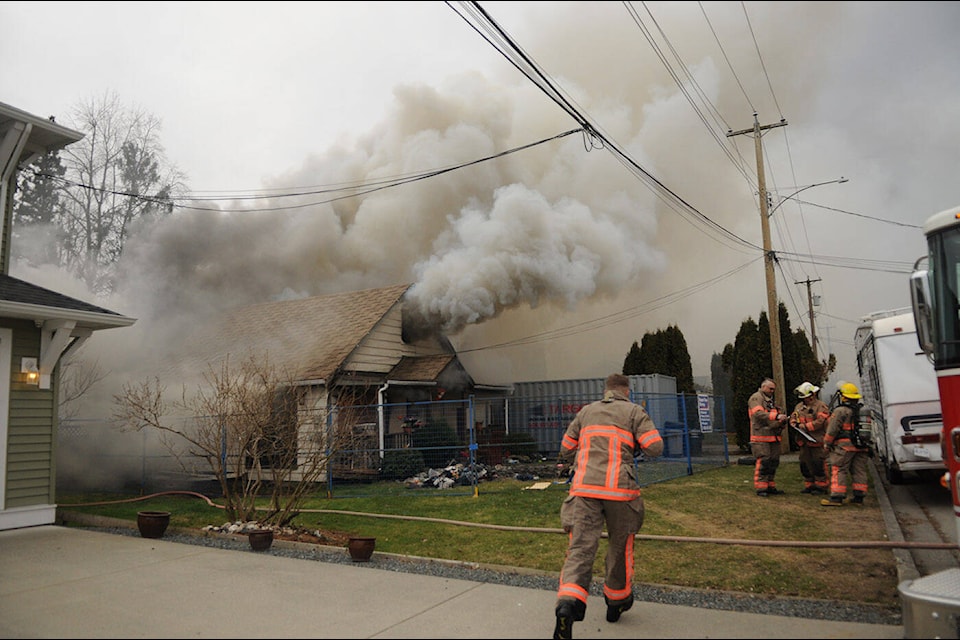 Firefighters were on scene at a blaze in a vacant house on Second Avenue in Chilliwack on Friday, March 10, 2023. It was the second fire at the house in less than two weeks. (Jenna Hauck/ Chilliwack Progress)