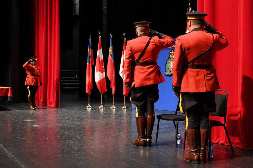 From left, Insp. Jeff Bowerman, Chief Supt. Bruce Singer (left) and Supt. Davy Lee salute during the annual Officer in Charge Awards Ceremony at the Chilliwack Cultural Centre on March 15, 2023. (Submitted by RCMP)