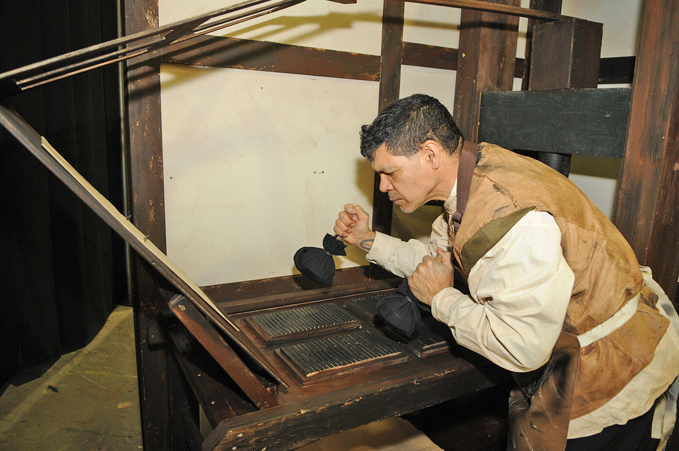 Lenny Fisher plays Marcus in the Chilliwack Players Guild production of The Book of Will which is at the Chilliwack Cultural Centre April 20 to 30. He is seen here using ink balls while pretending to ink up a handmade 17th-century style Gutenberg printing press made by guild member Rick Funk. (Jenna Hauck/ Chilliwack Progress)