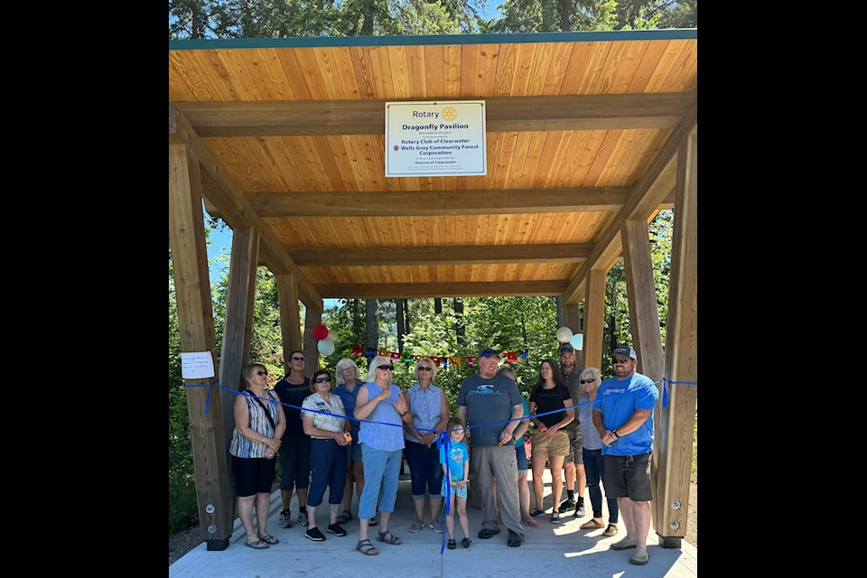 Clearwater Rotary and community members gathered for the dedication and ribbon cutting for the newly completed Dragonfly Pavilion on June 8 at the splash park. (From Left to Right): Larissa Hadley, Rotary ; Chris Burstrom, Rotary; Hazel Wadlegger, Rotary; Isabell Hadford, Rotary; Abbey Bates, Rotary; Lynn Frizzle, DOC Councillor; Merlin Blackwell, Mayor of District of Clearwater; Theresa Braaten, DOC Councillor; Kim and Dan Muddiman, Nest Timberhome & Design; Heather Maclennan, Wells Gray Community Forest (2010) Society; and Matt Edwards, Edward’s Concrete Solutions.  In front is Aislyn Demmon, honorary Rotarian who cut the ribbon.