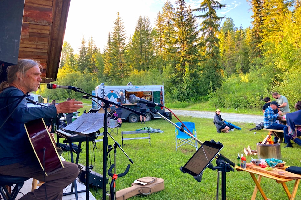 Local musician Geoff Ellen performing to the Solstice riders and hikers during the annual Solstice Ride and Hike at the Candle Creek trail network maintained by the Wells Gray Outdoors Club on June 21.  