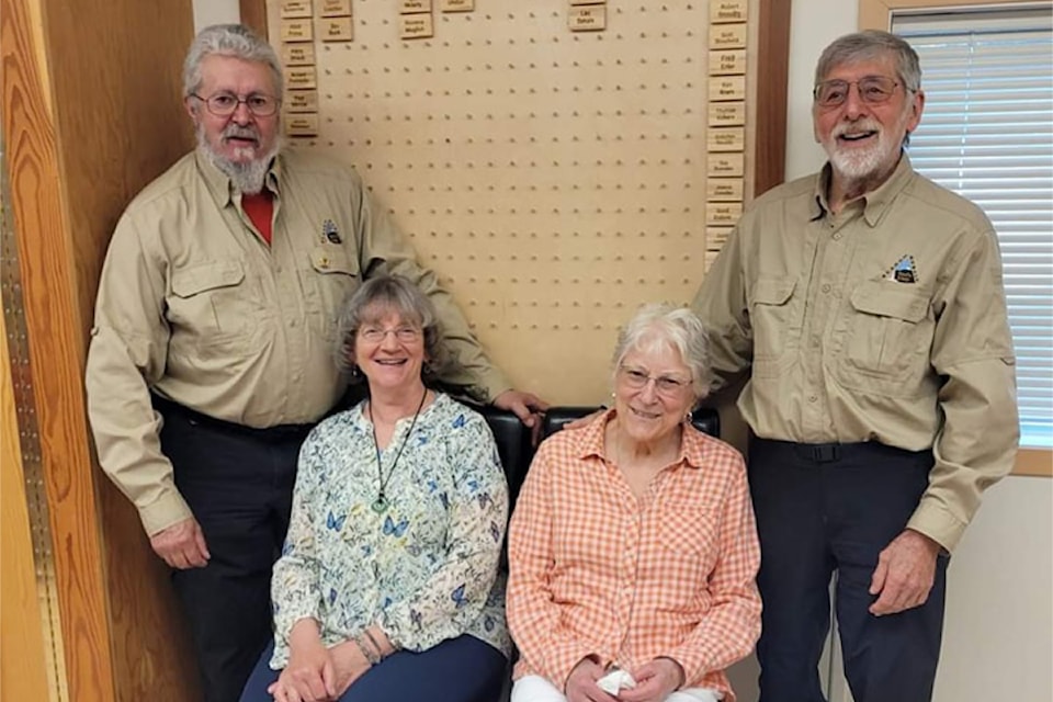 Wells Gray Search and Rescue 40-year members Kevin Deckert (l, with his wife Eleanor, seated l) and Les Sakals (r, with his wife BettyAnne). (Keith McNeill)