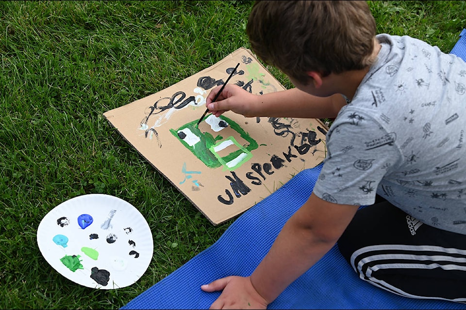 The kids were free to paint to their heart’s desire. Here, Sue Wakefield, 9, paints a robotic-looking face in the District of Clearwater field Monday morning. (Stephanie Hagenaars photo)