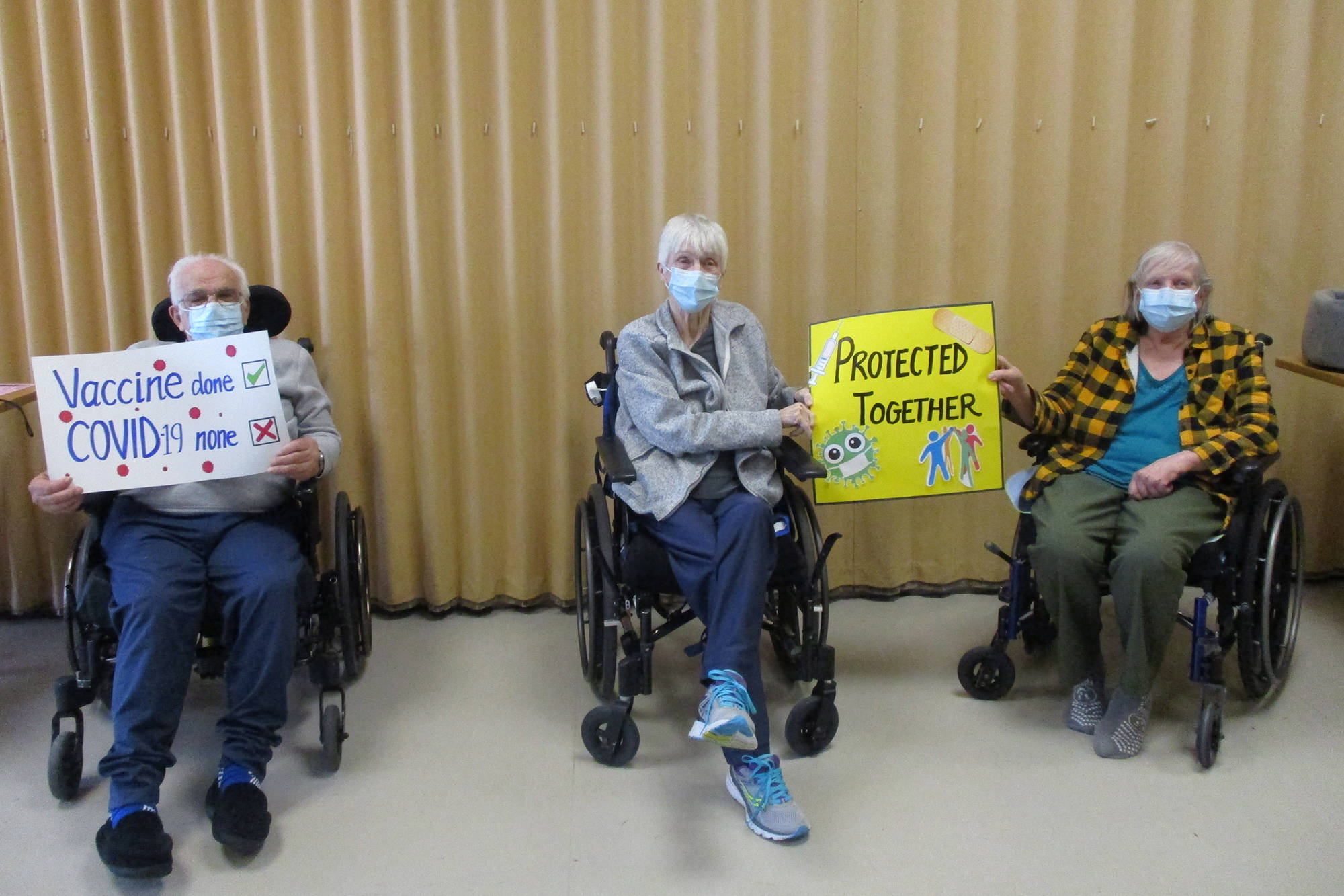 Residents at Cottonwoods Care Home in Kelowna celebrate receiving their COVID-19 vaccine. (Photo courtesy of Interior Health)