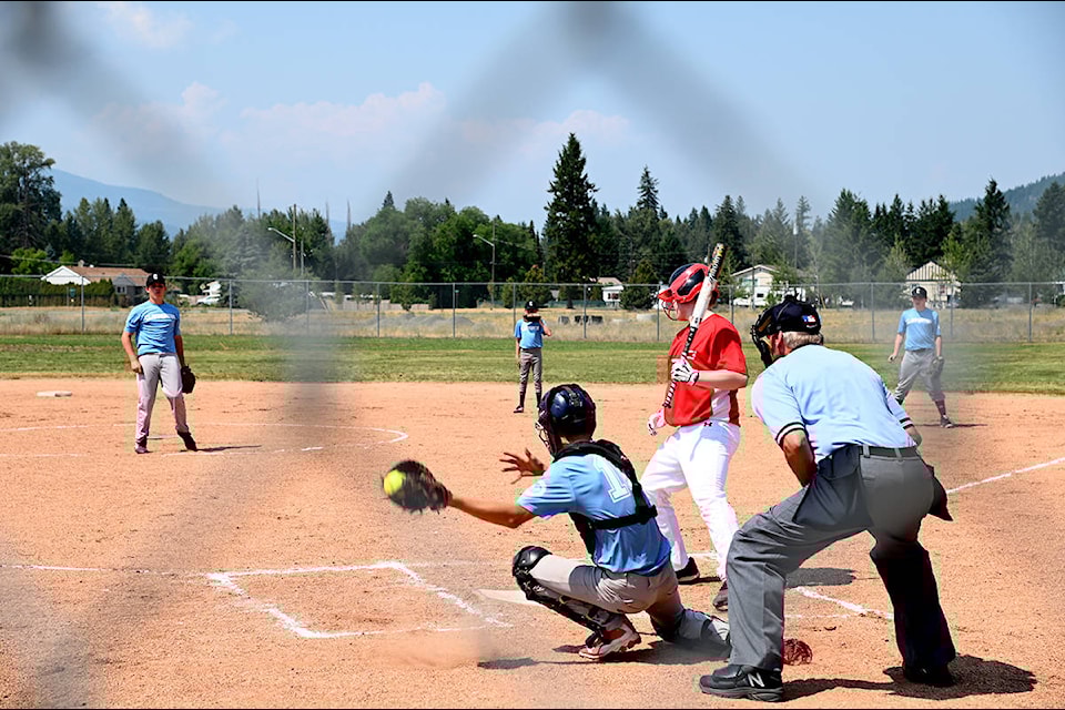 Owen Sim catches pitch from Devin Holland that goes a bit wide during a game against a team from 100 Mile House Friday afternoon. (Stephanie Hagenaars / surgeryitaly)