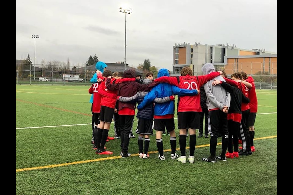 The CSS boy’s soccer team in a huddle before a game in Burnaby. (CSS Boys Soccer/Facebook)