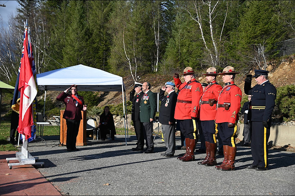 Veterans, as well as past and present members of the RCMP salute the flags at the Remembrance Day ceremony at the cenotaph in Reginald Small Park in Clearwater. (Stephanie Hagenaars/Clearwater Times)