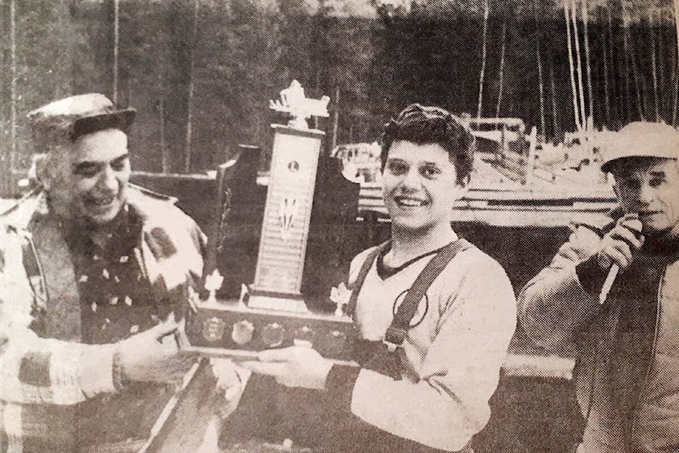 (L-r) Mount Olie’s Lions Club president, Bill Foucault presents Udo Wittich who gathered the most pledges with the first place trophy, with Clearwater’s M.C. Bill Mattenly announcing the winners of Snowarama 1982 in Little Fort, B.C. (NT Journal)