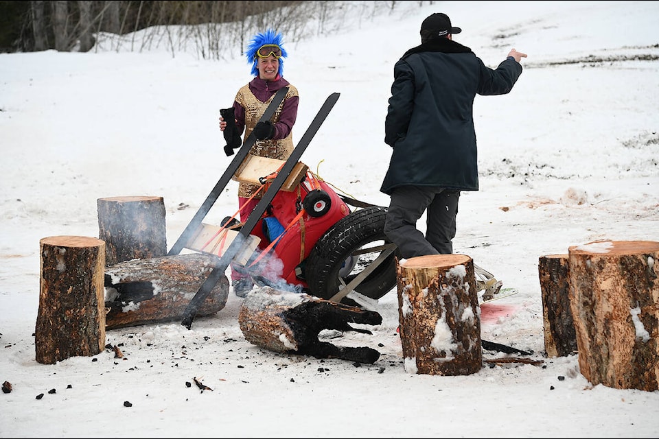 Kris and Jordan Olson check out the wreckage after their dummy skier slammed into a couple of logs at the bottom of the dummy ski races during Sunday Funday at the Clearwater ski hill. (Stephanie Hagenaars/Clearwater Times)