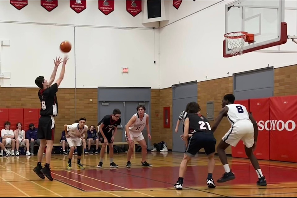 Corwin Schieck takes a shot while Zach and Serfie Gontcharov box out opposing players. The Clearwater Secondary School senior boy’s basketball team attended a tournament in the Okanagan at the end of Feb. It had been some time since the CSS team had qualified for the championships. (Submitted photo)