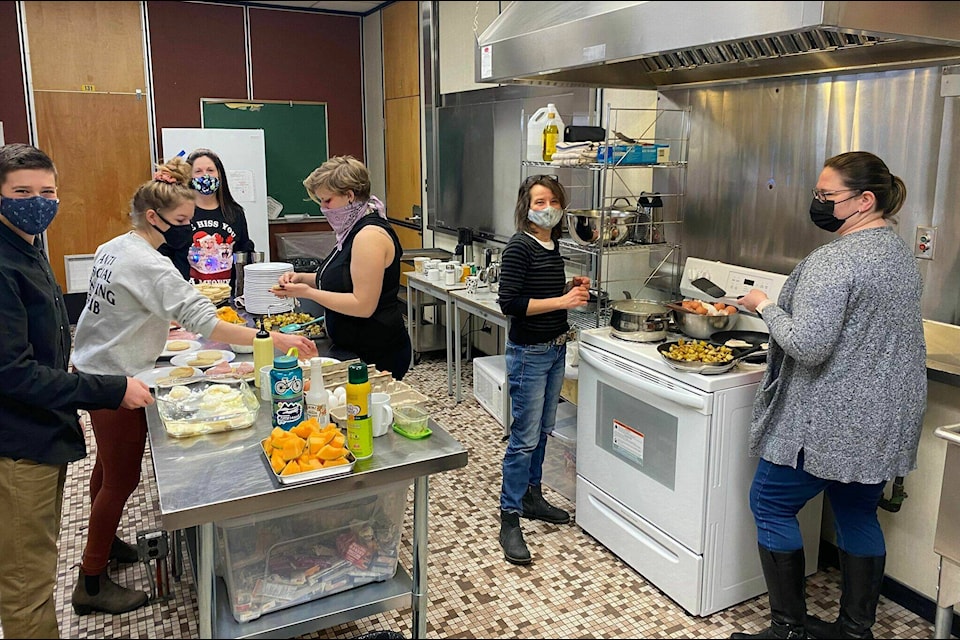 Volunteer parents and students are busy preparing food for the breakfast program at Clearwater Secondary School (Submitted photo)
