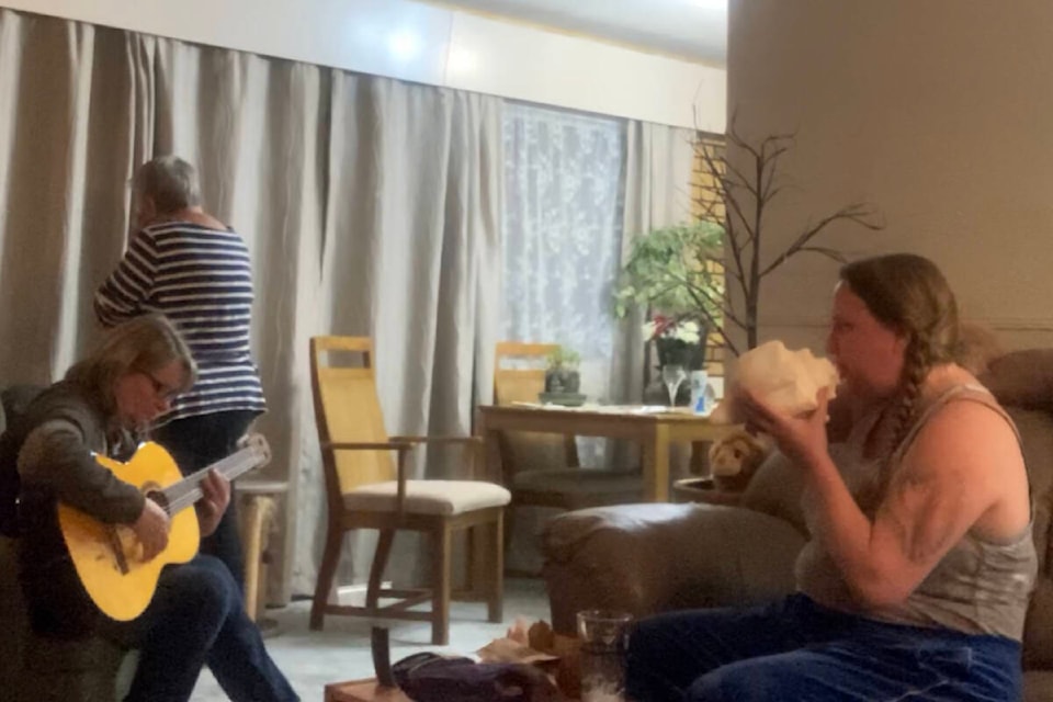 French horn musician and Royal Canadian Navy Naden Band member Alliszon Zaichkowski, right, plays one of her 20 conch shells during a jam session with her aunt, front left, and mother. Zaichkowski originally learned about the conch from William Golding’s Lord of the Flies and jokingly ordered her first one off eBay. (Courtesy of Alliszon Zaichkowski)