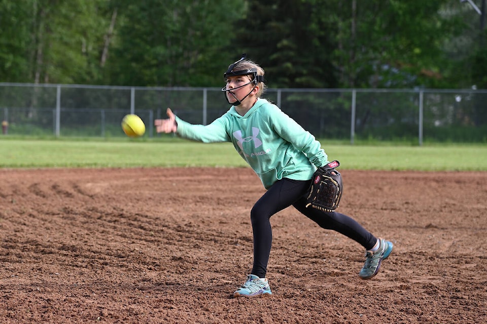 Simone Colborne practices her underhand pitching skills during a U9 minor ball practice on Thursday, June 16. (Stephanie Hagenaars photo)