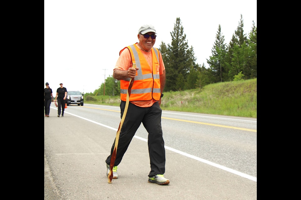 Stanley Fraser walks along Highway 97 on his way into 100 Mile House as part of his Walk and Talk Campaign. Fraser intends to walk all the way to Winnipeg to raise awareness about mental health. (Patrick Davies photo - 100 Mile Free Press)