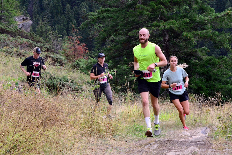 Clearwater’s Geoff Giesbrecht, left, Jean Ann Berkenpas of Valemount, Mark Bailey of Kamloops and Ashley Quaal of Birch Island compete in the 21-kilometre event. (Photo by Keith McNeill)