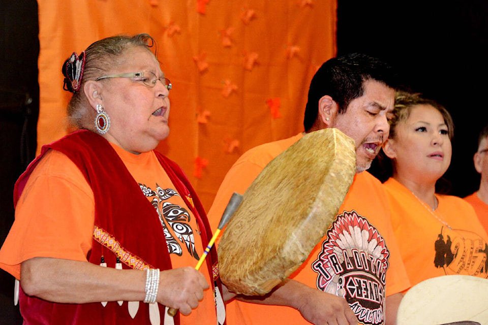 (L-r) Rose McArthur, Tim Edwards and Shaween Foureyes sing the Welcoming Song at the start of a National Truth and Reconciliation Day event at Dutch Lake Community Centre on Friday afternoon, Sept. 30. (Times photo by Keith McNeill)