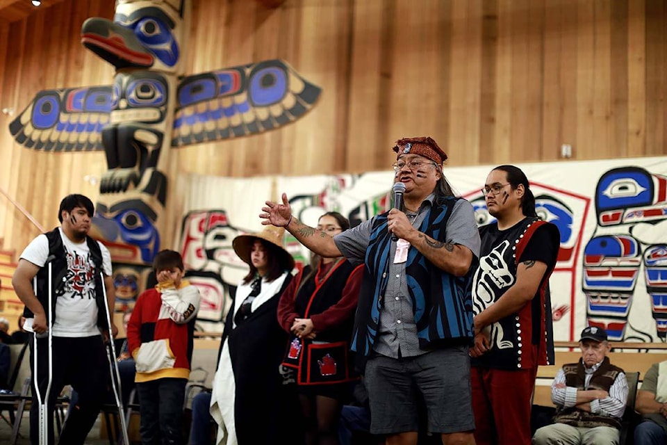 Maxwell Johnson delivers a speech directed at the Vancouver Police board in attendance as he’s joined by his family during the uplifting ceremony at the Big House in Bella Bella, B.C., on Monday, October 24, 2022. THE CANADIAN PRESS/Chad Hipolito