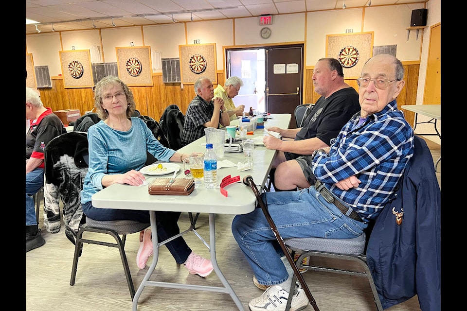 Maureen and Frank Wiseman take a break for lunch at the Legion Sunday. The couple organized a dart-a-thon and fundraiser for their friends Patti and Bruce Lyons who lost their home to a fire recently. (Angie Mindus photo - Barriere Star Journal)
