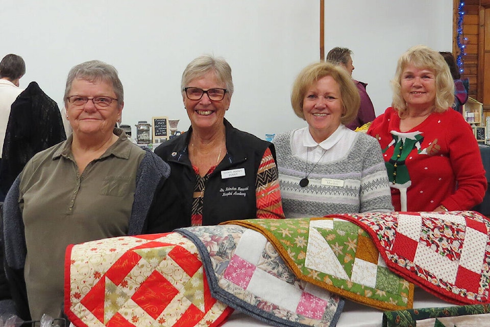 Dr. Helmcken Hospital Auxiliary members volunteer at a Craft Sale; Esther Therres, Penny Christenson, current president Marilyn Collison and Diane Toma. (Photo: Gail Capostinsky/Dr. Helmcken Memorial Hospital Auxiliary.)