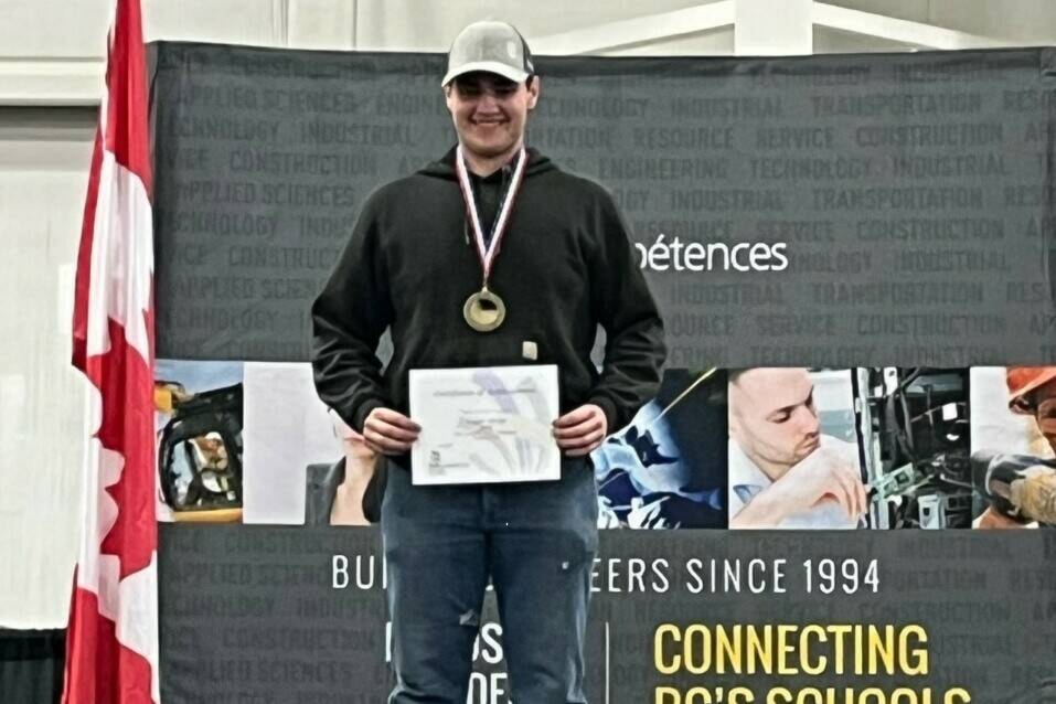 Logan Jones accepting his gold medal at the Skills BC Provincial Championships on April 19, 2023, in Abbotsford. (Photo submitted)
