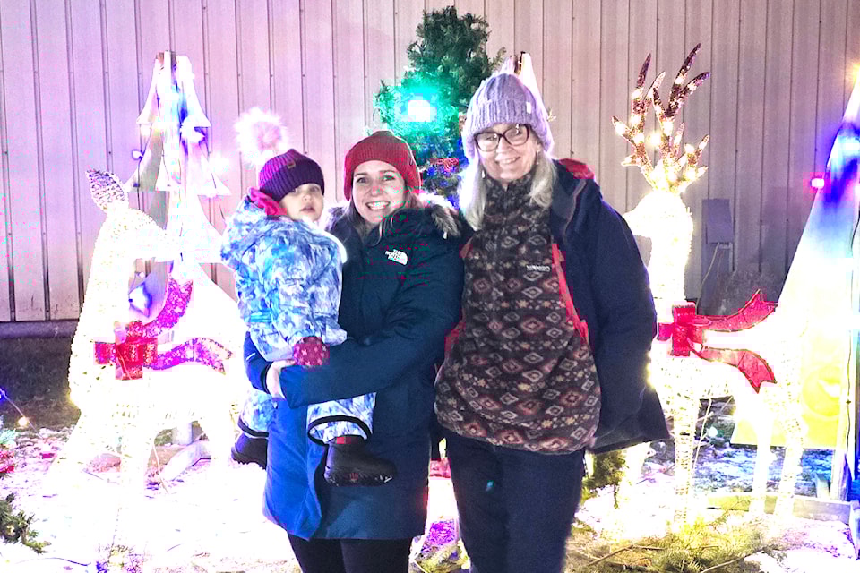 (From L - R): Barriere's Baby Annabel Teveluwe with mommy Shannon and visiting grandma, Helen Reidy from Australia who said "It's my first white Christmas!" on Friday Dec. 13 doing a walk about through Christmas at the Fair. 