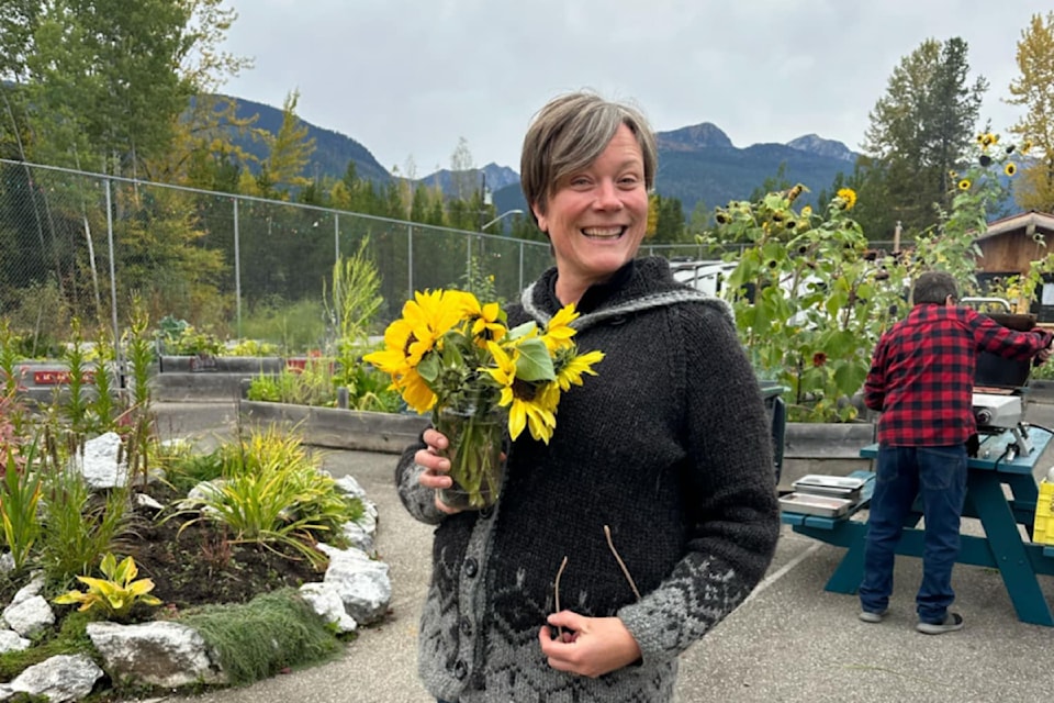 TNRD director for Area "B" in Lee Onslow enjoying the Blue River Community Garden thanks to grant funding from the North Thompson Communities Foundation, volunteers and other local initiatives. 