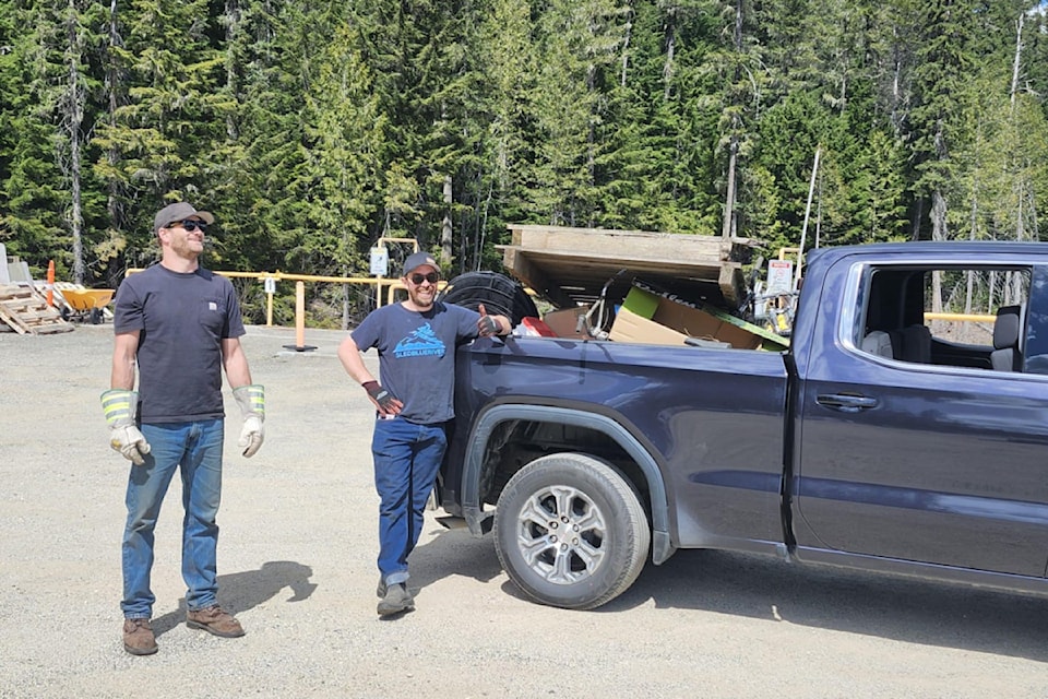 (From L - R): Dustin Dueling and JJ Jahnke volunteering during Blue River Clean Up Day on Sunday April 27. 