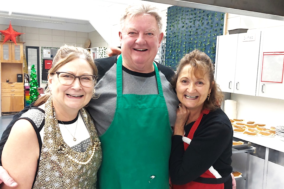The annual Community Luncheon at Barriere Secondary on Wed. Dec. 11 was a fun time for volunteers, students and staff while enjoying a full holiday meal prepared by community groups. (From L - R): Holly Fenrick, Mike McCarthy and Kris Luison