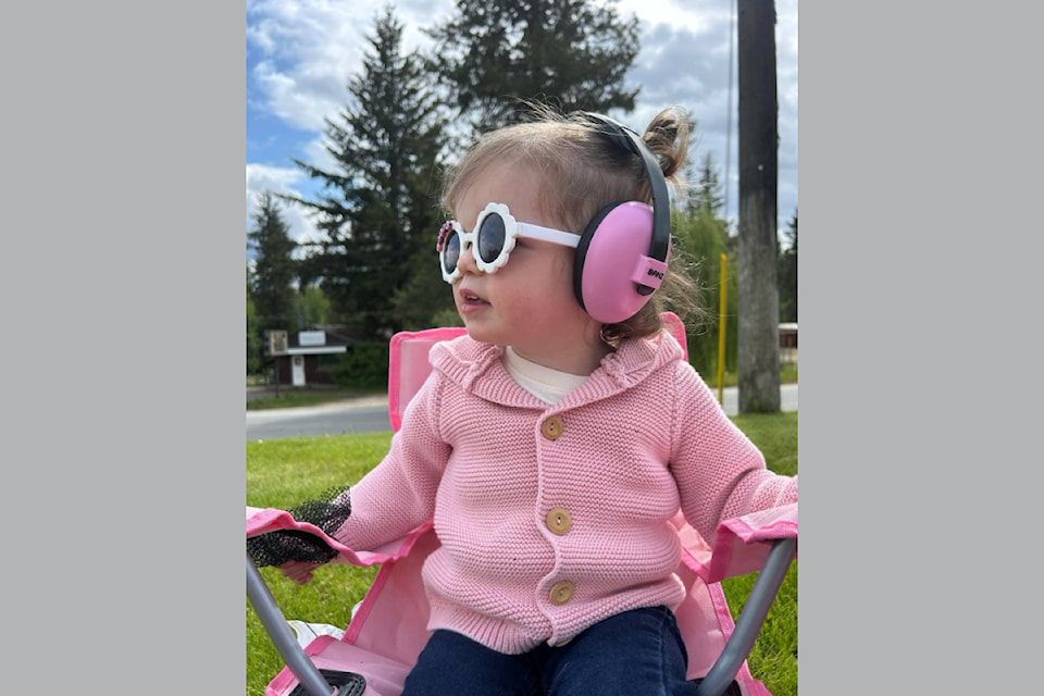 Little Clara Murray of Clearwater excited to see the May Day Parade on May 17 with momma Rae-Lee and daddy Aaron.
