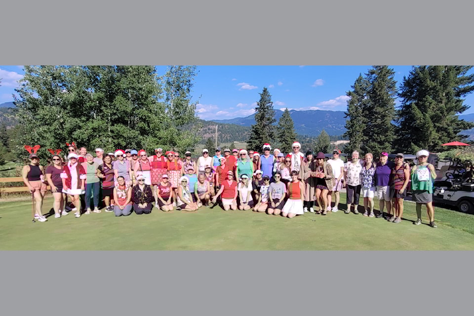All the ladies smiling and ready for Christmas in July which took place on Tuesday evening July 22 at Chinook Cove Golf Resort. 