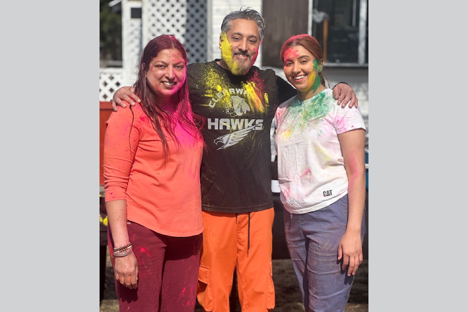 (from l) Harjit Sandhu with family friend AJ Bachhal and Harjit's daughter Princess Mavi celebrating the Holi Festival in Clearwater.