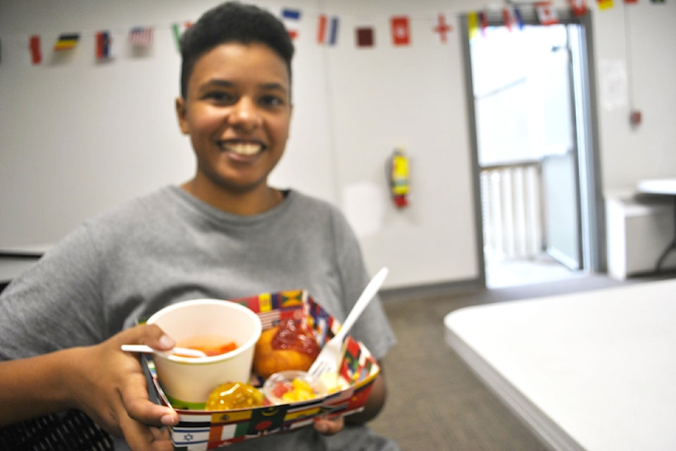 Kawiria Creed, recreation, culture and events assistant for the District of Clearwater with a variety of foods from around the world during the Oct. 4 Multicultural Food Day in Clearwater. 