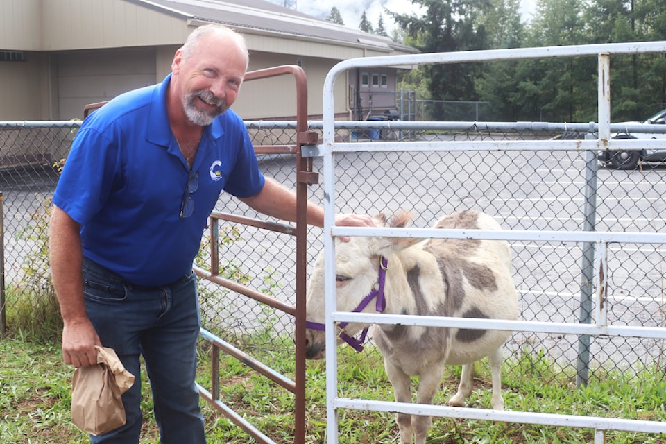 BC Conservative Party candidate running for MLA for Kamloops-North Thompson, Ward Stamer enjoyed meeting Katie the mini donkey during the Harvest Faire in Clearwater on Sept. 14.