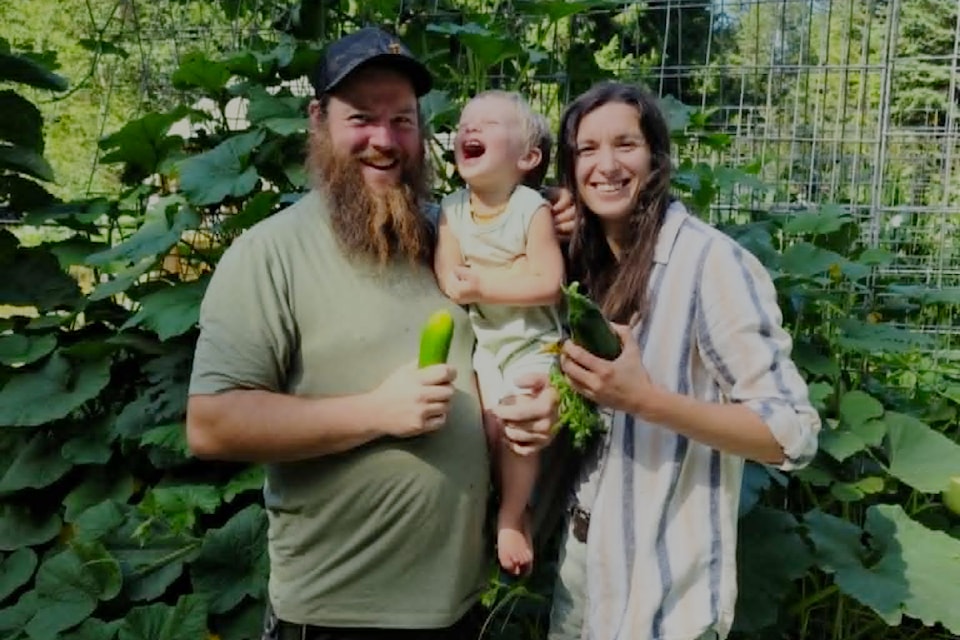 (from l): Jean-Yves Boucher, son Desmond, and wife Krysalynne Jones in their Grizzly Paw organic home garden on the edge of Wells Gray Park. 