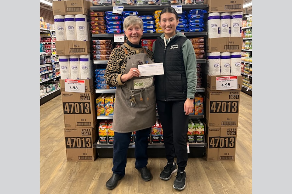 (From L - R): Louise Peters, president of the Barriere Food Bank accepts a cheque in the amount of $2,554.25 from AG Foods employee, Monica Lee on Wednesday Dec. 4. The donation comes from the annual Harvest Supersaver Coupon Book sales each fall with proceeds benefiting local charities. 