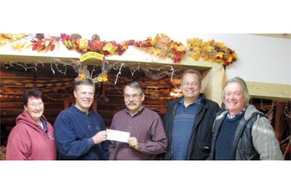 From our archives - Nov. 2011. Tim Pennell, TNRD director for Area "A" presented a Grant-in-Aid to Upper Clearwater Farmer’s Institute in the amount of $2,000.