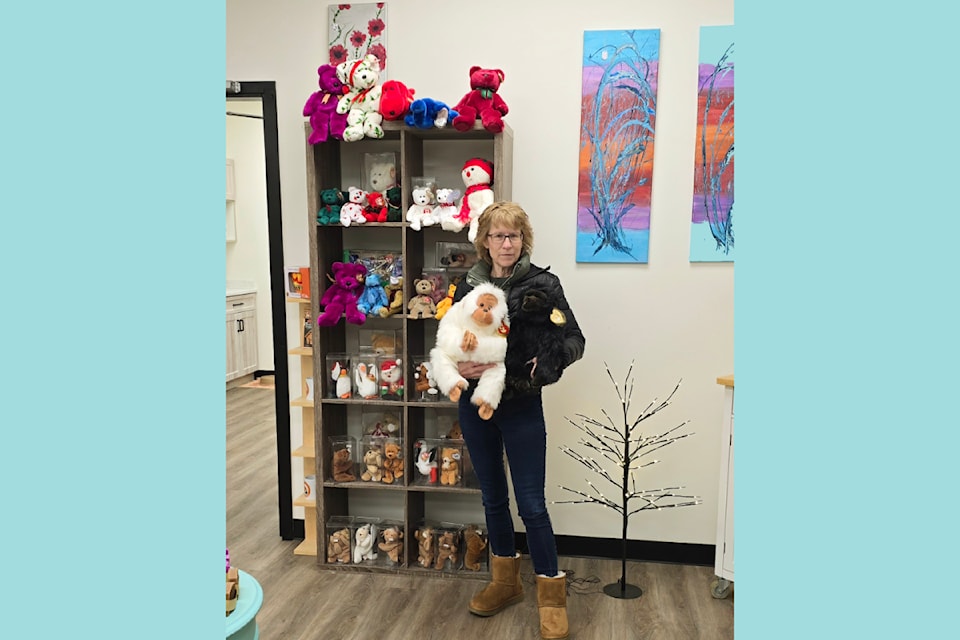 Barriere and District Chamber of Commerce office administrator, Lianne Hamblin poses with a large Beanie Baby collectible on Monday, Dec. 2. The collection was donated to chamber to "bring joy to others" in memory of a local resident who passed away.