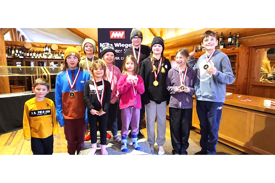 Elementary school students from Blue River proudly display their medals after taking part in the Andy Aufschnaiter Memorial cross country ski races sponsored by Mike Wiegele’s in Blue River on Feb. 13.