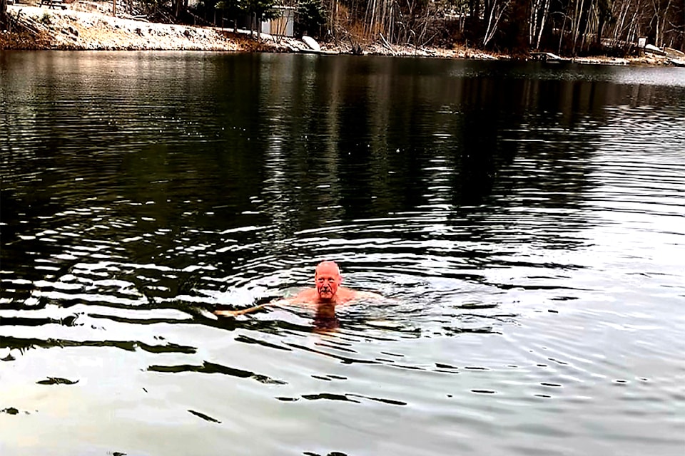 Brent Buck of Clearwater enjoying a New Year's Day polar bear plunge in Dutch Lake.