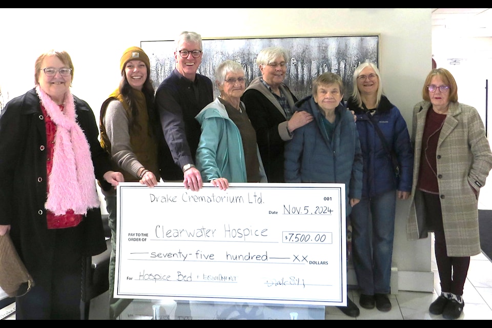 Clearwater Hospice Society accepts a cheque in the amount of $7,500.00 from Drake and Avril Smith on behalf of Drake's Crematorium Ltd. (from l) Cheryl Johnson, Tammy Whelen (vice-president), Drake Smith, Jean Nelson, Roberta (Bobbi) Parsons, Diane Sherk, Margaret Hartley and Eileen Bell.