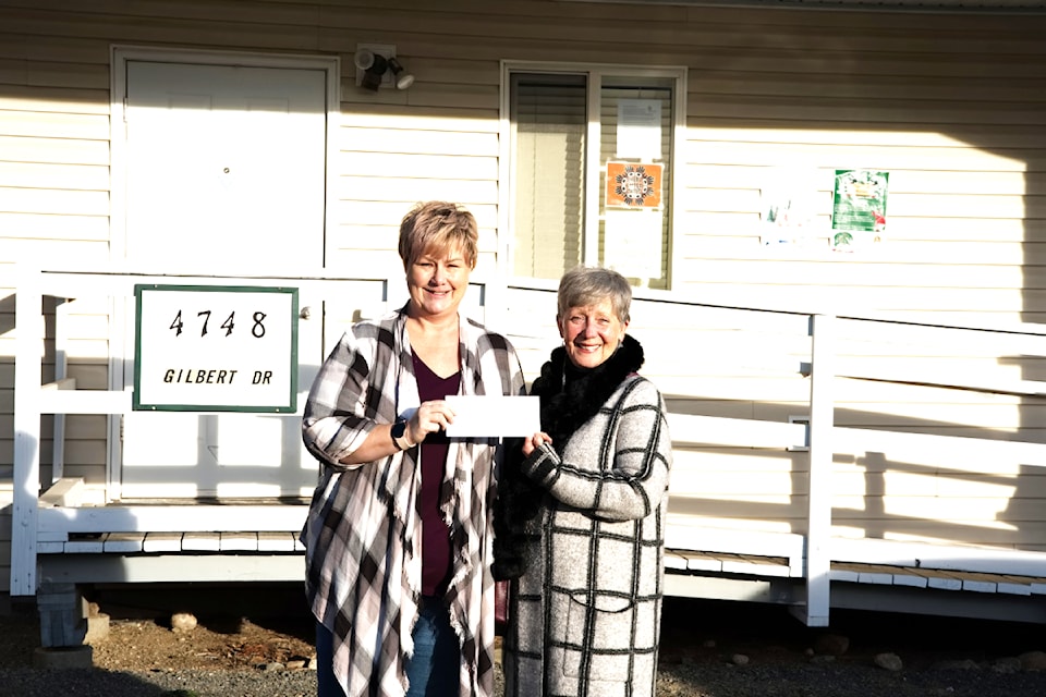 (From L - R): Ellen Monteith, executive board member for CUPE 900 presents a cheque for $200 to Barriere Food Bank president, Louise Peters, on Monday Dec. 2 in Barriere. 