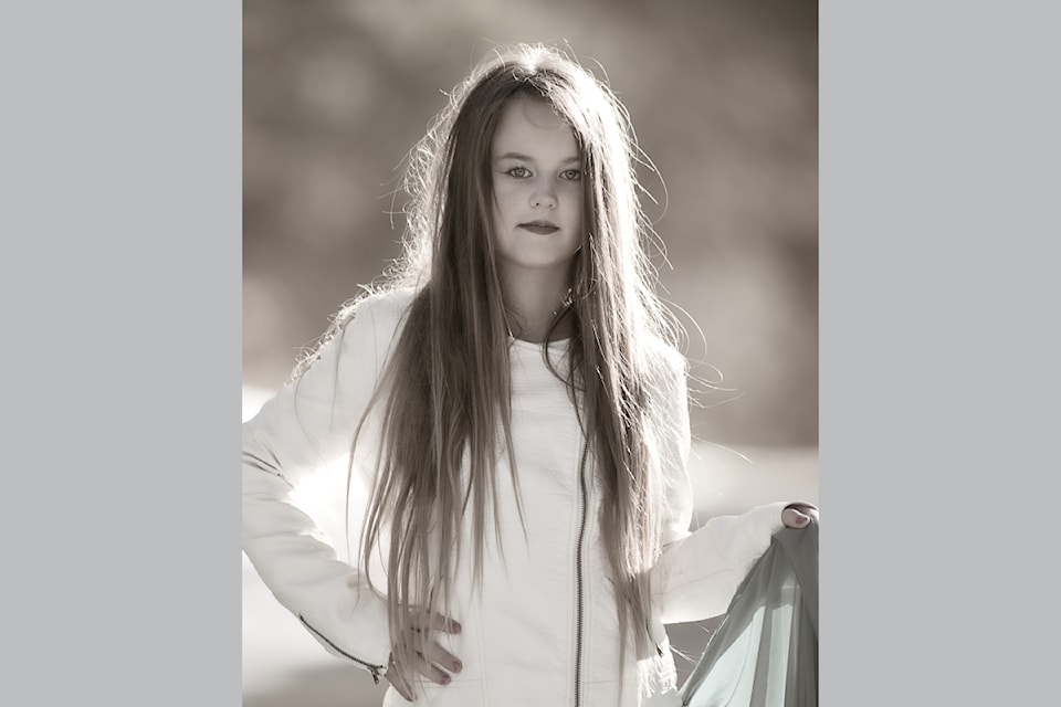 John Enman spends the day with friend Jo and her daughter,  Evinn (seen here) and son Emit while taking outdoor portraits.